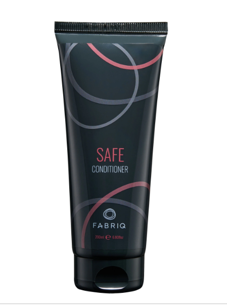 A 250ml squeeze tube of FABRIQ Safe Conditioner, featuring a dark charcoal gray/black background with abstract pink and gray circular line designs and white and pink text.